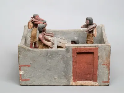 Wooden model of a granary with a scribe and overseer recording the yield, from a Middle Kingdom tomb. Metropolitan Museum of Art, MET 11.150