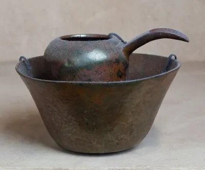 A copper ewer from a matched basin and ewer set, Dynasty 5 (2465–2323 BCE). Objects of this kind were used for hand washing, though since al