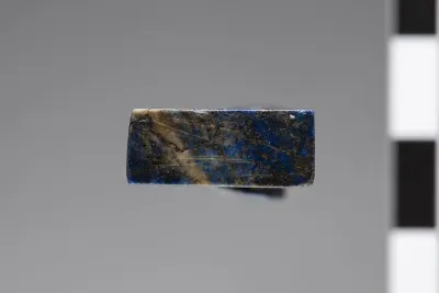 The underside of a ba bird amulet carved from lapis lazuli, dating to the Late Period (664–332 BCE). The ba represented one aspect of the hu