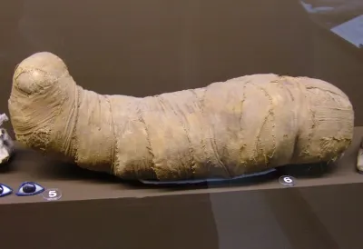 A natron salt offering bundle, wrapped and formed into a mummy shape, dating to the Second Intermediate Period. Rosicrucian Egyptian Museum,