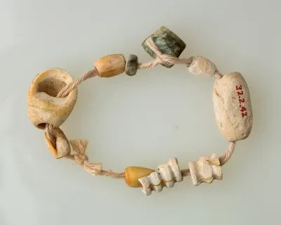 String of beads made of bone, serpentinite and shell (ca. 4400–3800 B.C.E). Northern Upper Egypt, Matmar, Tomb 6001