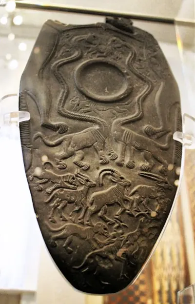 The Two Dogs Palette (also called the Oxford Palette), Naqada III, c. 3200 to 3100 BCE, from Hierakonpolis. Its serpopards — mythical long-n