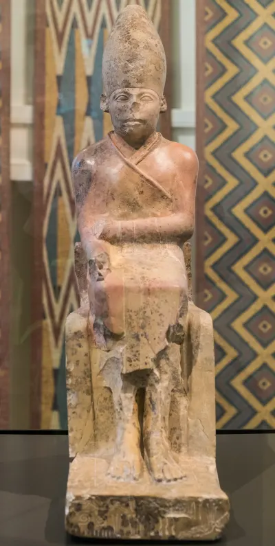 A limestone seated statue of King Khasekhemwy, standing 62cm tall and dating to around 2700 BCE (2nd Dynasty). Excavated at Hierakonpolis, o